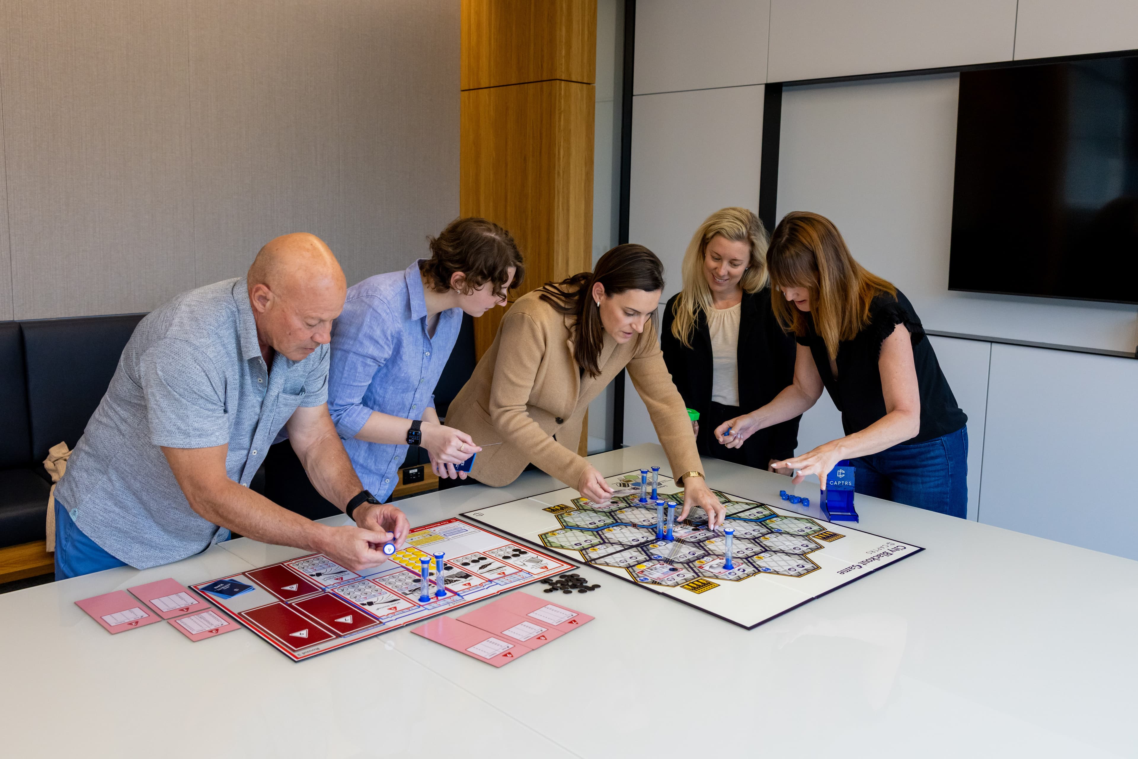 Strategic planning session with game materials